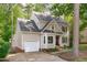 Attractive home with a welcoming facade, including an attached garage and well-manicured landscaping at 120 Avent Pines Ln, Holly Springs, NC 27540