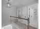 The home's second story hallway provides access to bedrooms and other living spaces at 120 Avent Pines Ln, Holly Springs, NC 27540