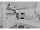 Bright kitchen with white subway tile backsplash, stainless steel appliances, and stylish lighting fixtures at 120 Avent Pines Ln, Holly Springs, NC 27540
