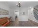 Open-concept living area with wood floors, chandelier, and views into other rooms, providing a seamless flow at 120 Avent Pines Ln, Holly Springs, NC 27540