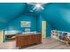 This blue office provides space for all of your work from home needs, with a large desk and shelving at 120 Avent Pines Ln, Holly Springs, NC 27540