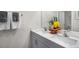 Elegant bathroom features dual sinks with modern faucets and fixtures and decorative accents at 1205 Pavo Path, Wendell, NC 27591