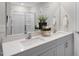 Modern bathroom with double sinks, vanity, and a large mirror at 1205 Pavo Path, Wendell, NC 27591