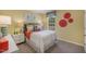 Bright bedroom with colorful decor, complemented by natural light from the window at 1205 Pavo Path, Wendell, NC 27591