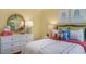 Cozy bedroom with decorative pillows, dresser, and stylish decor at 1205 Pavo Path, Wendell, NC 27591
