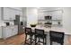 Well-appointed kitchen featuring an island with seating, modern appliances, and stylish finishes at 1205 Pavo Path, Wendell, NC 27591