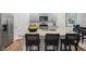 Modern kitchen with gray cabinets, granite countertops, stainless steel appliances, and a central island at 1205 Pavo Path, Wendell, NC 27591