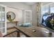 Bright home office with a view of the entryway, stylish desk decor, and natural light at 1205 Pavo Path, Wendell, NC 27591