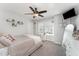 Bright bedroom with neutral decor, a ceiling fan, and sunny windows at 121 Woodstaff Ave, Wake Forest, NC 27587