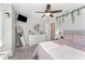 Stylish bedroom with ceiling fan, large mirror, and decorative accents at 121 Woodstaff Ave, Wake Forest, NC 27587