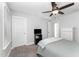 Minimalist bedroom with ceiling fan, carpeted floors, and plenty of natural light at 121 Woodstaff Ave, Wake Forest, NC 27587