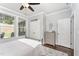 Comfortable bedroom featuring a metal frame bed, a dresser, and natural light at 121 Woodstaff Ave, Wake Forest, NC 27587