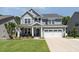 Charming two-story home with a well-manicured lawn, beautiful landscaping and a two car garage at 121 Woodstaff Ave, Wake Forest, NC 27587