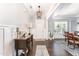 Inviting foyer with hardwood floors, elegant console table, and an open view to the dining area at 121 Woodstaff Ave, Wake Forest, NC 27587