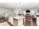 Modern kitchen with stainless steel appliances, granite counters and an open floor plan to the living room at 121 Woodstaff Ave, Wake Forest, NC 27587