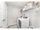 Clean and efficient laundry room with modern washer and dryer, shelving, and ample storage space at 121 Woodstaff Ave, Wake Forest, NC 27587