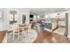 Open concept living space with a kitchen, dining area, and living room with hardwood floors and neutral decor at 121 Woodstaff Ave, Wake Forest, NC 27587