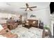 Open-concept living space with kitchen, dining area, and living room featuring a fireplace and hardwood floors at 121 Woodstaff Ave, Wake Forest, NC 27587