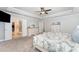 Elegant main bedroom with neutral colors featuring walk-in closet and ensuite bathroom at 121 Woodstaff Ave, Wake Forest, NC 27587