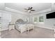 Spacious main bedroom features tray ceilings, a ceiling fan, and three large windows at 121 Woodstaff Ave, Wake Forest, NC 27587