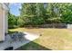 Backyard featuring a patio and lush lawn at 1221 Tartarian Trl, Apex, NC 27502