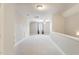 Spacious, carpeted bonus room with neutral paint, ceiling fan, and a window with decorative curtains at 1221 Tartarian Trl, Apex, NC 27502