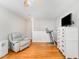 Living Room with hardwood floors, a TV, and comfortable chair at 1221 Tartarian Trl, Apex, NC 27502