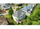 Aerial view of the home showcasing the rear exterior, roof, deck, and surrounding landscaping at 12508 Angel Falls Rd, Raleigh, NC 27614