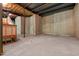 Unfinished basement with concrete floor and block foundation at 12508 Angel Falls Rd, Raleigh, NC 27614