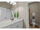 Bright bathroom features a marble vanity, modern fixtures, and a connected shower at 12508 Angel Falls Rd, Raleigh, NC 27614