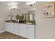 Bathroom features double vanity, granite countertops, decorative mirror and recessed lighting at 12508 Angel Falls Rd, Raleigh, NC 27614