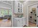 Butler's pantry featuring white cabinets and countertop, opening to pantry and living room at 12508 Angel Falls Rd, Raleigh, NC 27614