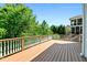 Spacious wooden deck with a beautiful backyard and mature trees at 12508 Angel Falls Rd, Raleigh, NC 27614