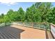 Large, inviting wooden deck with scenic views of lush greenery at 12508 Angel Falls Rd, Raleigh, NC 27614