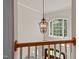 Foyer view features chandelier, a window, and natural wood railing at 12508 Angel Falls Rd, Raleigh, NC 27614