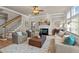 Comfortable living room with a fireplace, neutral walls, hardwood flooring, and cozy furniture at 12508 Angel Falls Rd, Raleigh, NC 27614