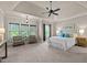 Spacious main bedroom with tray ceiling, ceiling fan, sitting area and ample natural light at 12508 Angel Falls Rd, Raleigh, NC 27614