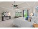 Comfortable main bedroom with seating area, tray ceiling and large windows offering natural light at 12508 Angel Falls Rd, Raleigh, NC 27614