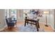 Bright office space with hardwood floors, natural light from the large window, and stylish decor at 12508 Angel Falls Rd, Raleigh, NC 27614