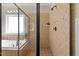 Shower features tiled shower with glass door, built in shelf and window to tub at 12508 Angel Falls Rd, Raleigh, NC 27614