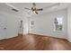 Spacious main bedroom with tray ceilings, fan, ensuite bath, and picture windows at 1303 Whitsett St, Burlington, NC 27217
