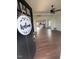Inviting entryway with hardwood floors and an open view into the modern kitchen at 1303 Whitsett St, Burlington, NC 27217
