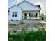 Beautiful newly built home featuring a welcoming porch and modern white siding at 1303 Whitsett St, Burlington, NC 27217