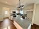 Well-lit kitchen featuring granite counters, stainless appliances and a large island at 1303 Whitsett St, Burlington, NC 27217