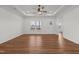 Bright and airy living room with hardwood floors, a ceiling fan, and an open layout at 1303 Whitsett St, Burlington, NC 27217