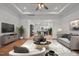 Comfortable living room showcasing stylish decor, a ceiling fan, and an open layout at 1303 Whitsett St, Burlington, NC 27217