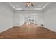 Spacious living room featuring hardwood floors, a ceiling fan, and an open layout at 1303 Whitsett St, Burlington, NC 27217