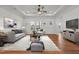 Elegant living room with a ceiling fan, natural light, and an open layout at 1303 Whitsett St, Burlington, NC 27217