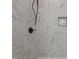 Modern shower featuring white marble-patterned tiles, a sleek black faucet, and a built-in shampoo niche at 1303 Whitsett St, Burlington, NC 27217