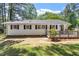 Rear exterior view of a charming home with a well-manicured lawn and tasteful landscaping at 1314 Hudson Ave, Durham, NC 27705